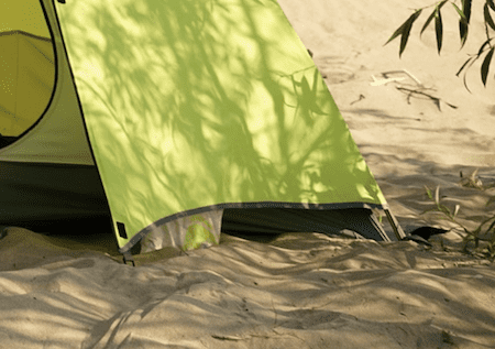 tent staked in sand